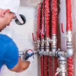 Plumber Checking Water Supply System