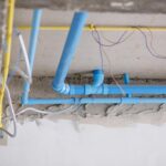 plumbing pipe near wiring