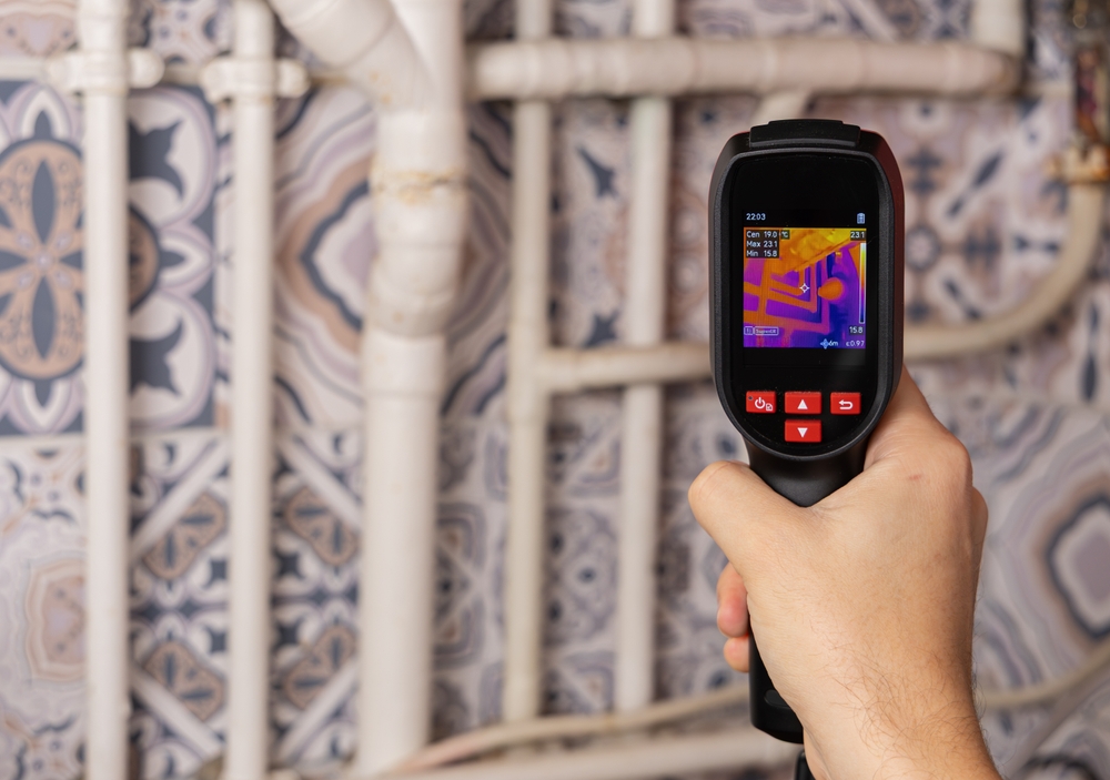 plumber using FLIR thermal camera