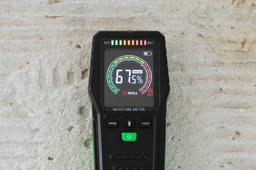 moisture meter detecting concrete water leak
